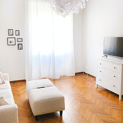 Couch, stand and TV on hardwood flooring from our Oak Park flooring company.